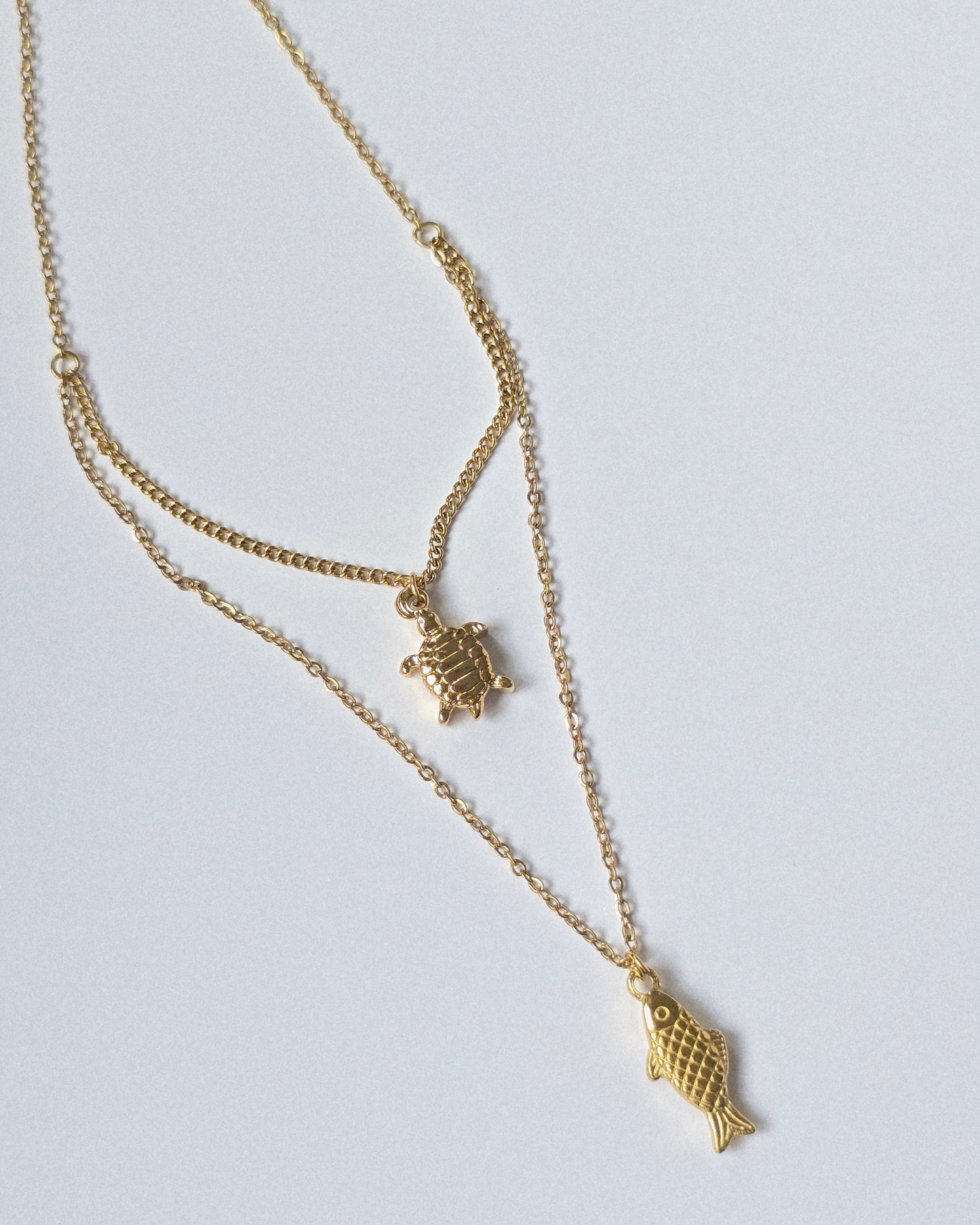 Collar doble tortuga / pez